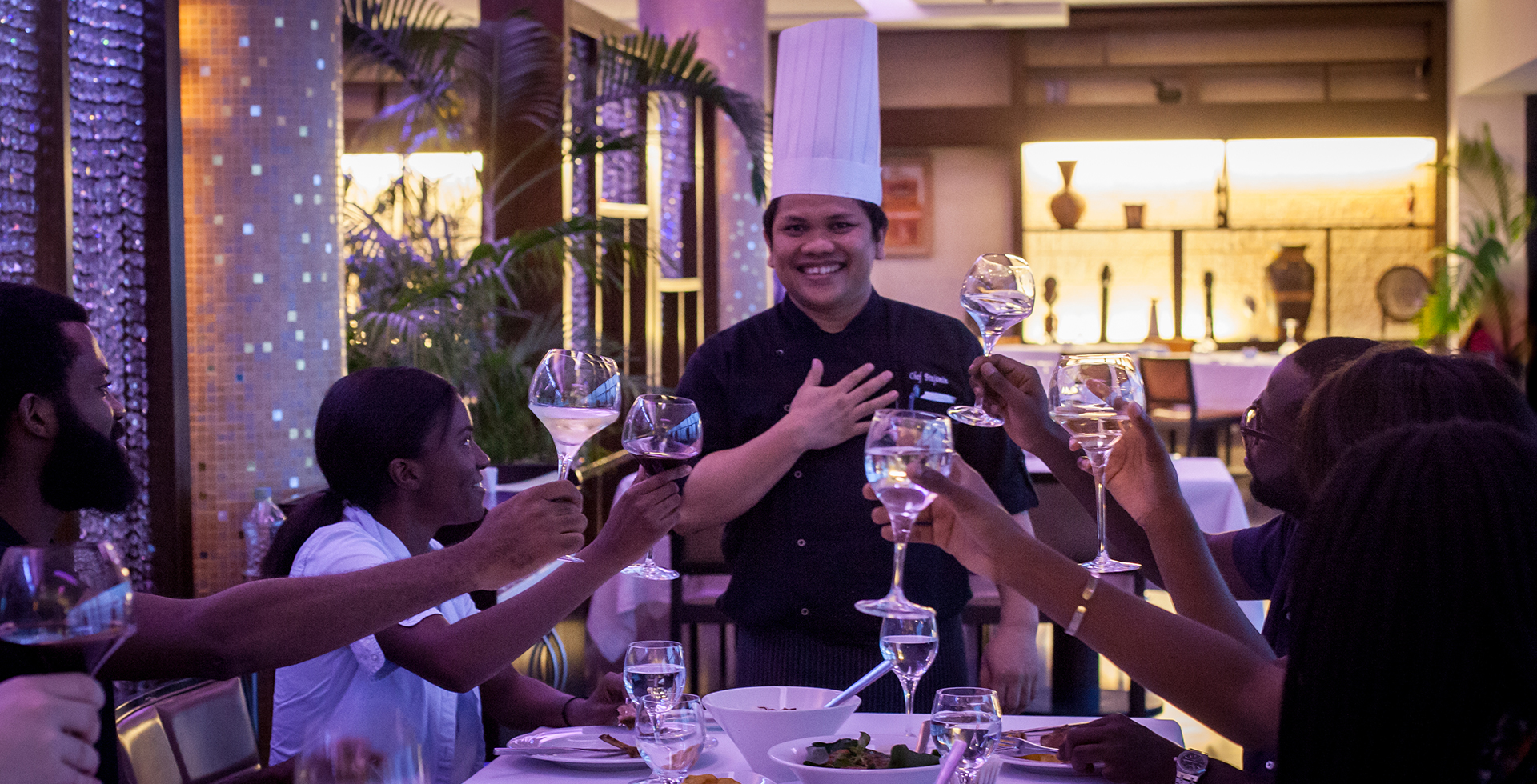 chef serving customers with a smile